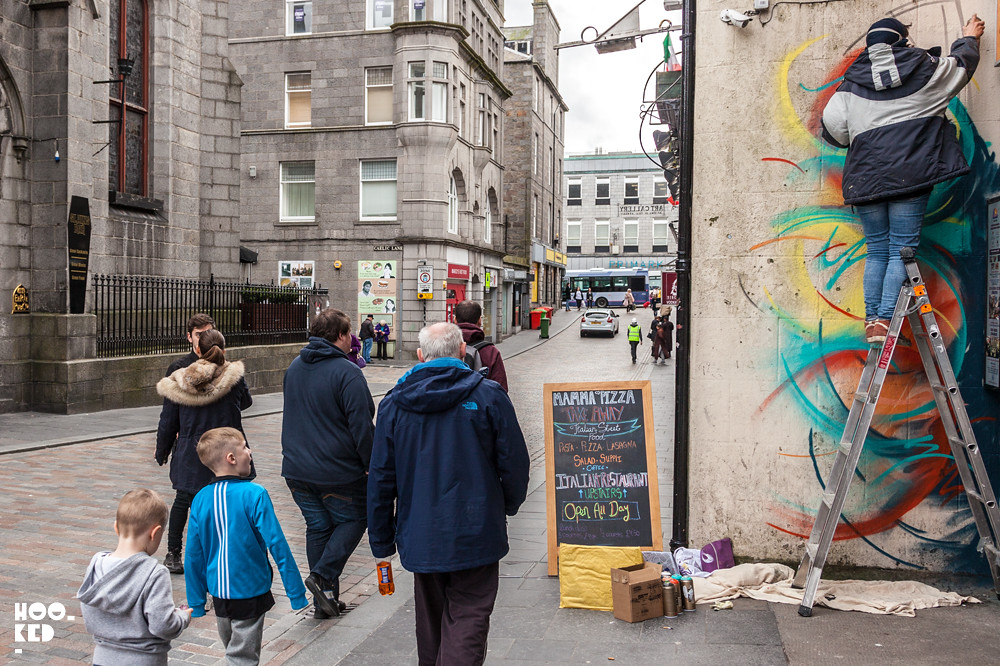 Artist Alice Pasquini at work, Aberdeen Street Art Mural in Scotland. Photo ©Hookedblog /  Mark Rigney