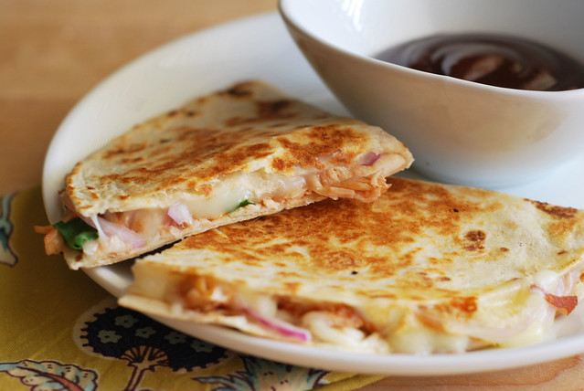 BBQ Chicken Quesadillas - chicken, mozzarella cheese, red onion, cilantro, and barbecue sauce stuffed into a flour tortilla and grilled until golden and crispy! Super easy and fast weeknight meal!