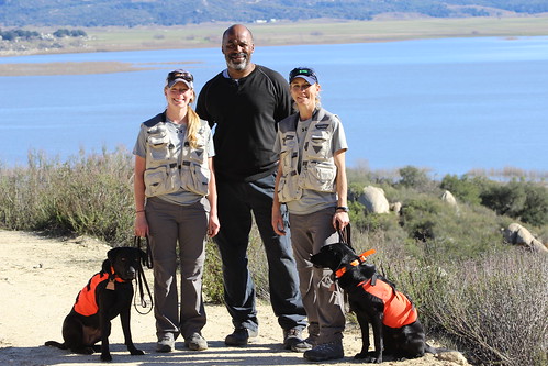Canine handlers and a training specialist with APHIS detector dogs