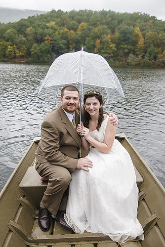 The happy newlyweds didn't seem to mind the rain. Wedding Photography at Douthat State Park by Craig Spiering Photography.