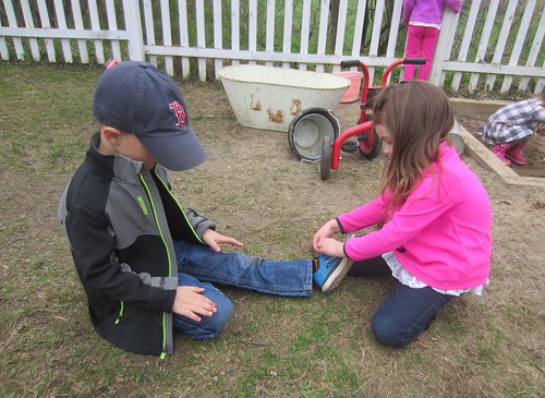 helping a friend tie his shoe