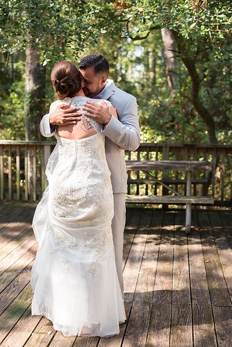 A special time for the bridge and groom at First Landing State Park, Va. Wedding photo courtesy of Caitlin Gerres Photography
