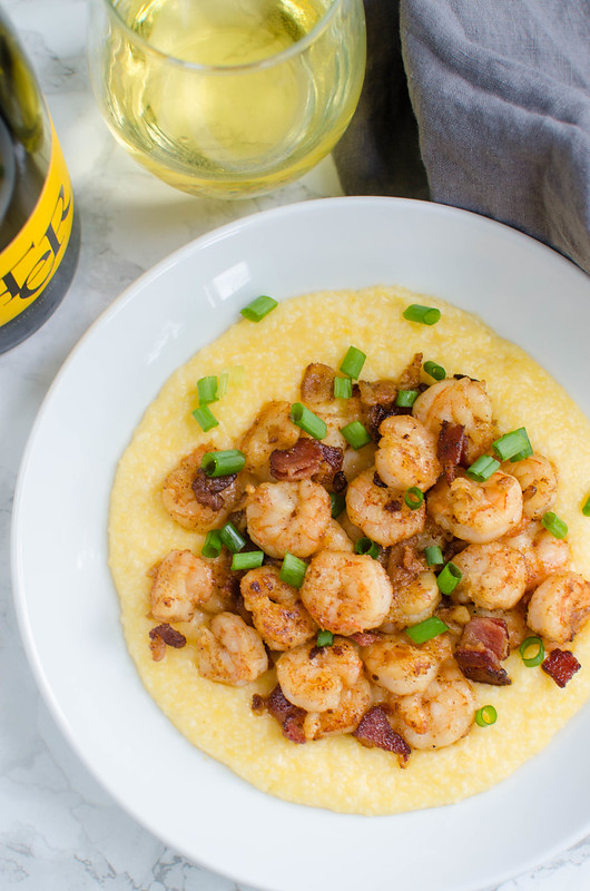 Cajun Shrimp and Grits - spicy shrimp with cheesy grits! Super simple recipe that feels very decadent. Perfect for brunch or a date night in!