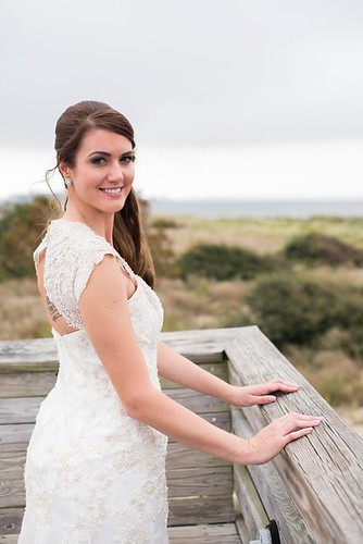 A beautiful bride ready to meet her groom for their wedding. First Landing State Park wedding photo courtesy of Caitlin Gerres Photography