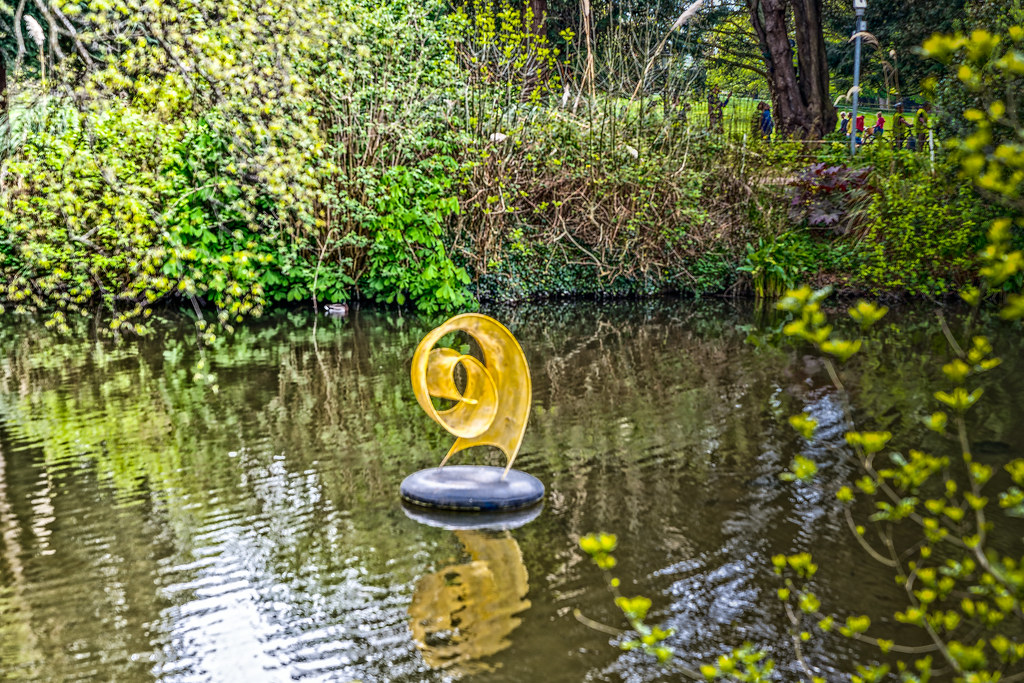 UNFURLING SCULPTURE BY ANNE McGILL [FLOATING ON THE LAKE AT FARMLEIGH]-127286