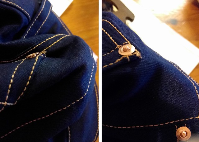 A rivet in hand made jeans.