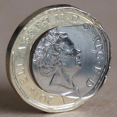 One pound coin with bleeding center