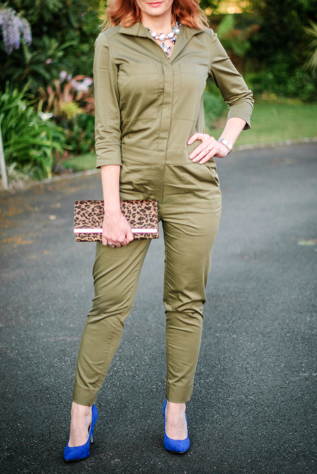 What to wear with a safari-style khaki jumpsuit: Cream fedora statement crystal necklace cobalt blue heels leopard clutch | Not Dressed As Lamb, over 40 style