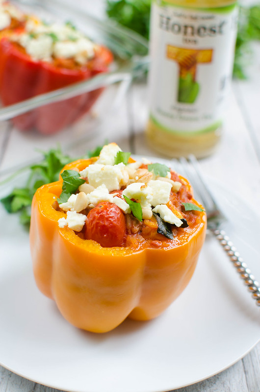 Greek Stuffed Peppers - easy, healthy, and delicious! Peppers filled with turkey, rice, zucchini, tomatoes, and topped with feta cheese!