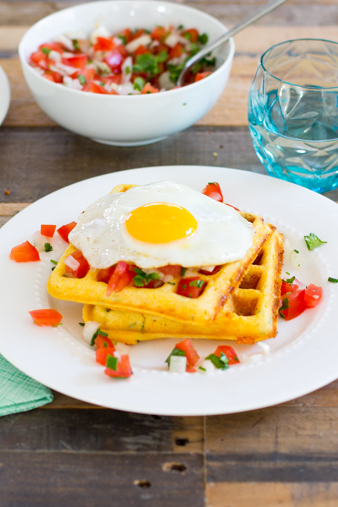 Cornmeal cheddar chipotle waffles with salsa and fried egg.