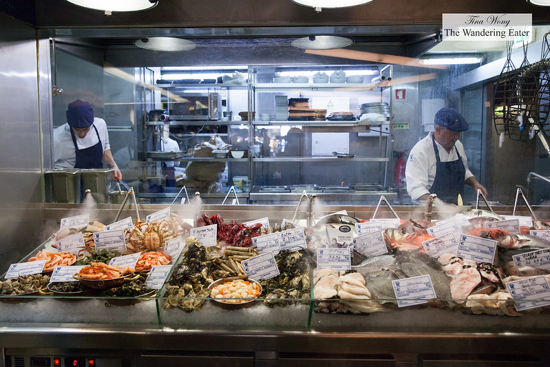 Large seafood display in front of the kitchen, priced per kg