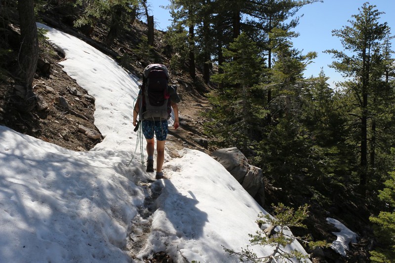 We hike across soft snow on the north slope of the ridge as the PCT continues south of Coon Creek