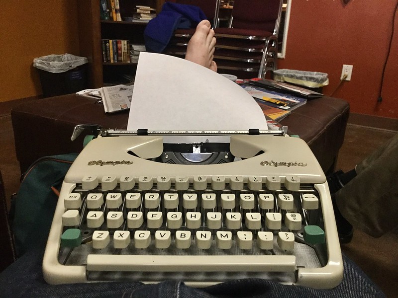 Barefoot Lap Typing at the cigar store