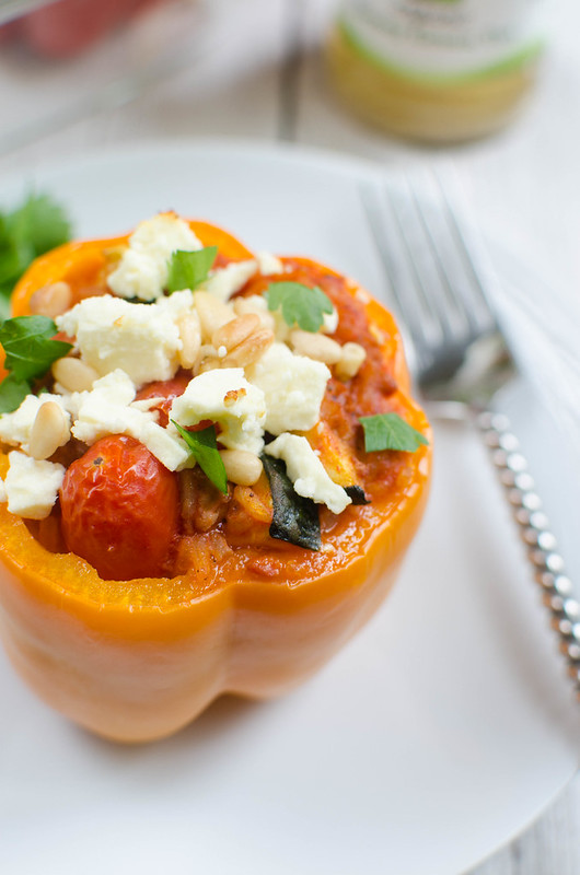 Greek Stuffed Peppers - easy, healthy, and delicious! Peppers filled with turkey, rice, zucchini, tomatoes, and topped with feta cheese!