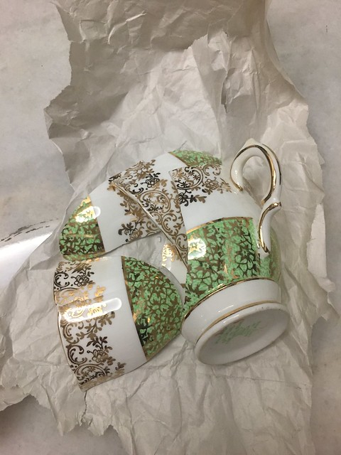 Broken green and white cups from UK