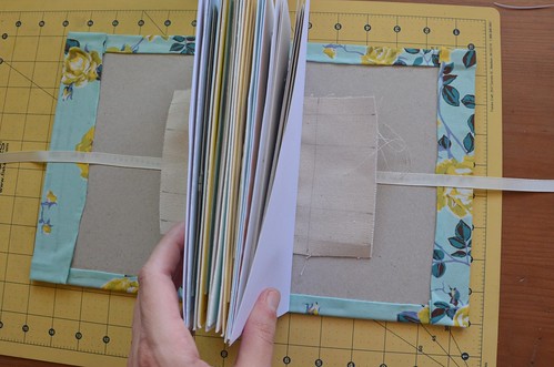 30. Press binding canvas with wet glue to book board spine (centered)