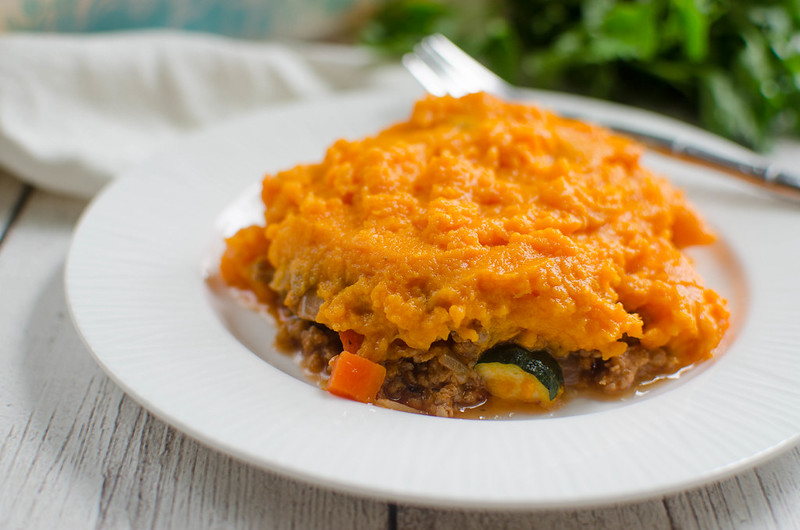 Paleo Shepherd’s Pie - perfect comfort food! Beef and veggies in a rich tomato gravy and topped with mashed sweet potatoes!