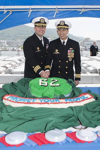 SASEBO - Cmdr. Bryce Benson and Cmdr. Robert Shu cut a cake after a change of command ceremony. Cmdr. Bryce Benson relieved Cmdr. Robert Shu during the change of command ceremony.