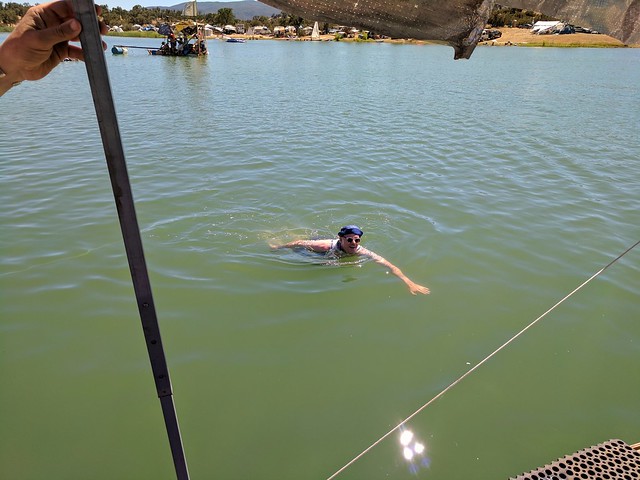 Jon swimming to the boat