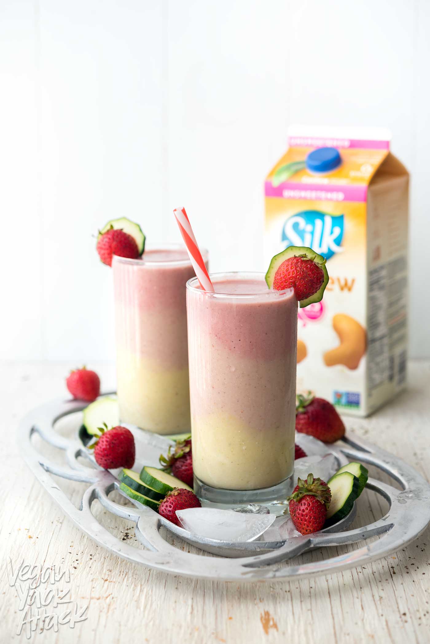 This Strawberry Peach Smoothie has beautiful, creamy layers, with some sneaky ingredients! Perfect for breakfast, or to cool down this summer. #vegan #glutenfree #soyfree #veganyackattack #SilkSmoothies