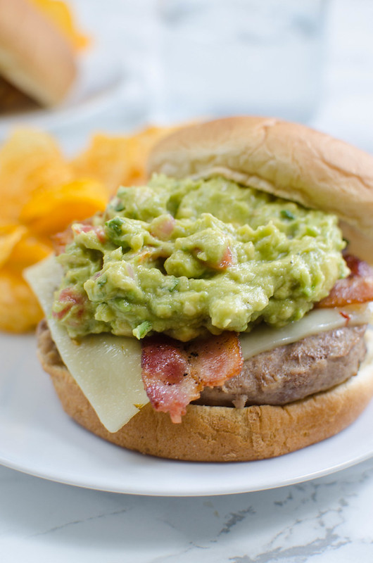 Guacamole Bacon Burger - delicious turkey burgers topped with pepper jack cheese, crispy bacon, and creamy guacamole. So spicy and delicious!