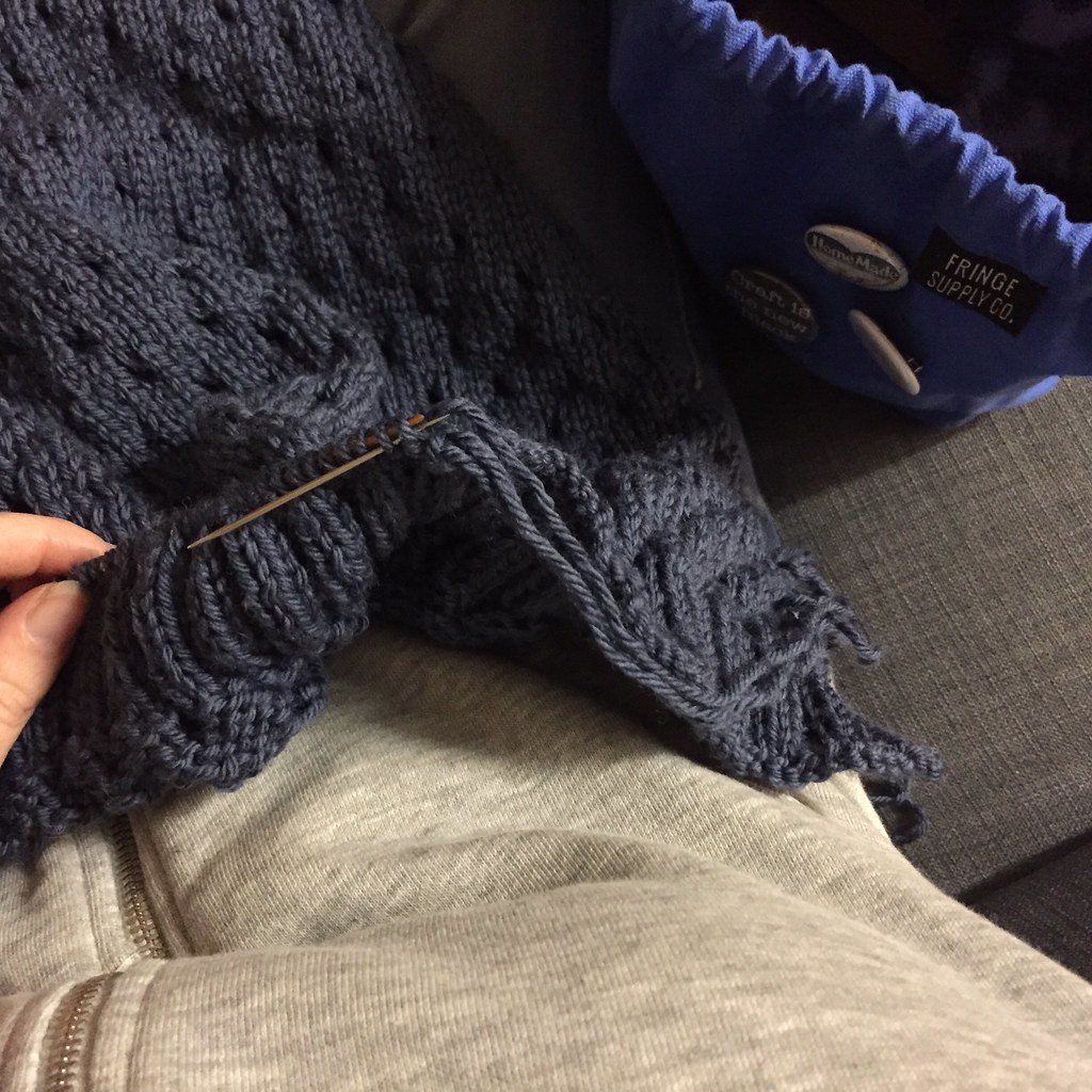 sewing the bind off of the bottom of my cardigan