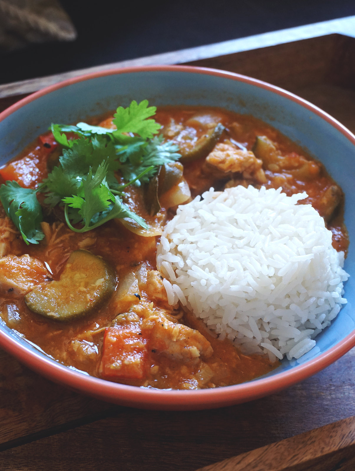 Healthy low carb coconut chicken stew served with rice and fresh coriander