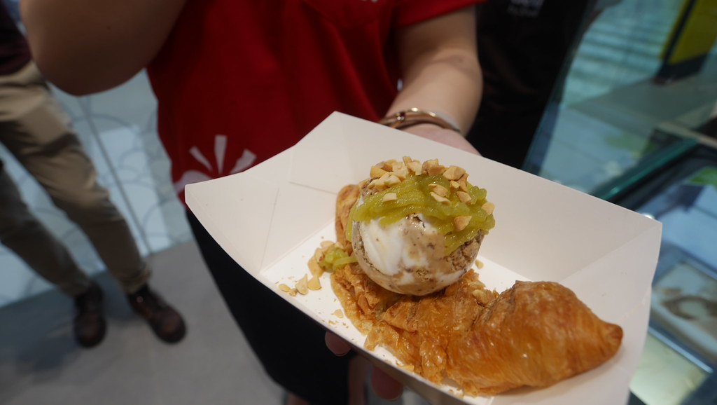 The Nanyang Brekkie features a scoop of cappuccino ice cream on a hot butter croissant, with lashings of pandan kaya and coarsely chopped peanuts.