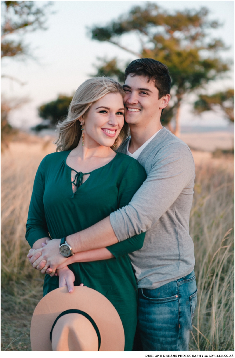 Serene winter engagement shoot with pops of green