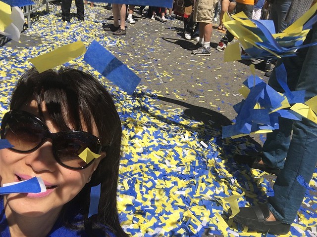OMB playing with confetti,  Warriors parade