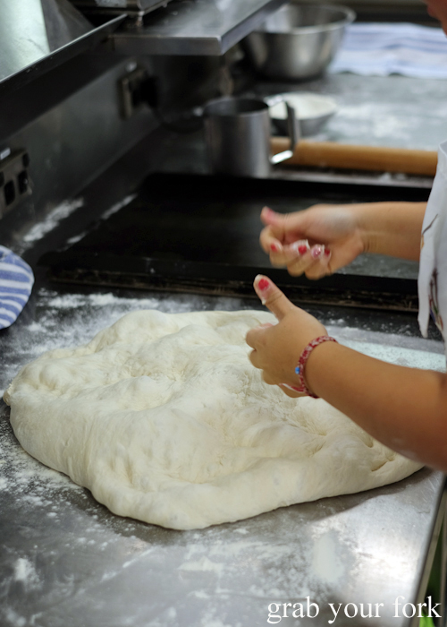 Knocking down the dough during the Italian and French Artisan Bread Making Class at Sydney TAFE