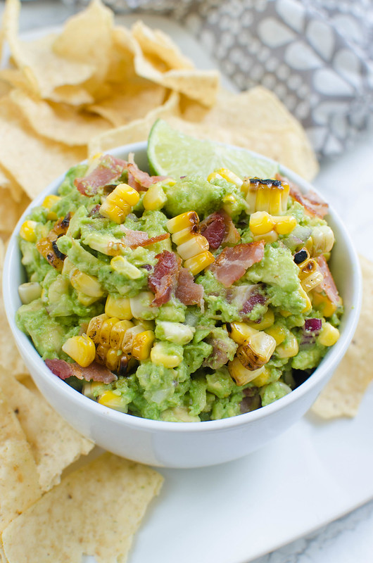 Charred Corn and Bacon Guacamole - a delicious and easy twist on the classic! A super simple guacamole recipe with grilled corn and bacon!
