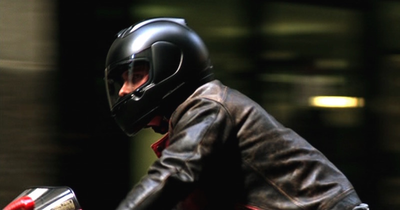 Bruce Wayne riding a MV Agusta F4 wearing an Arai: RX-7 CORSAIR Helmet in Black Frost