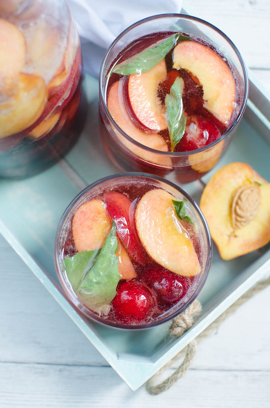 Peach Cherry Sangria - white wine sangria with peaches, cherries, and fresh basil! The perfect summer drink!