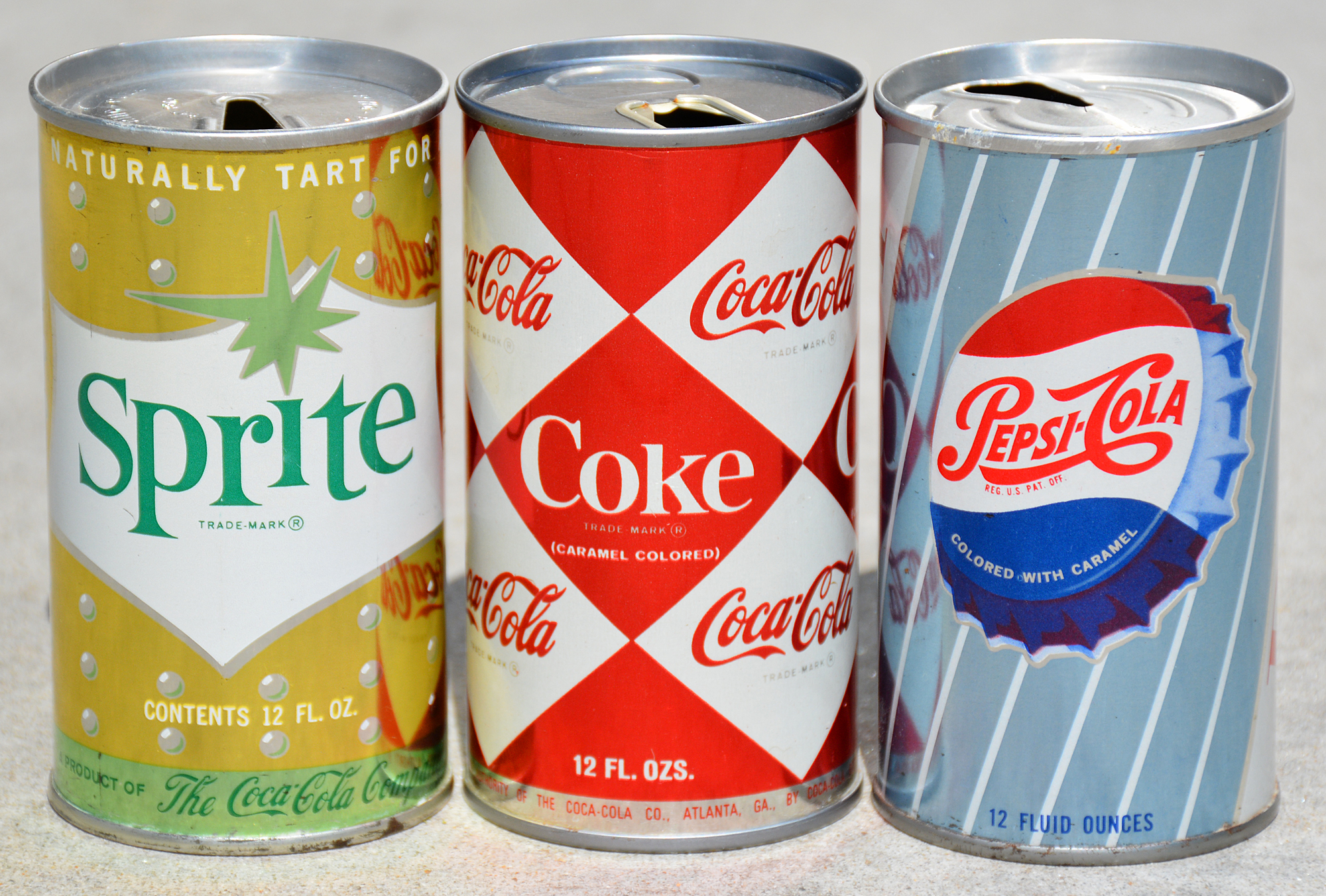 Sprite, Coca-Cola, and Pepsi-Cola cans - mid-1960s