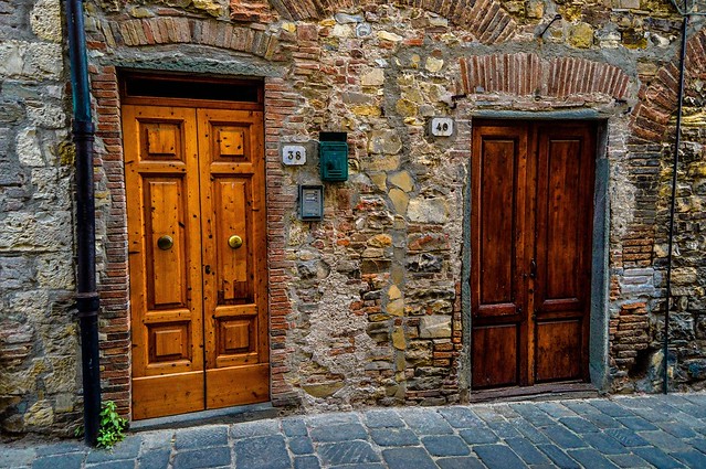 Tuscan doors. From San Donato In Poggio in Pictures: The Beauty of Tuscany