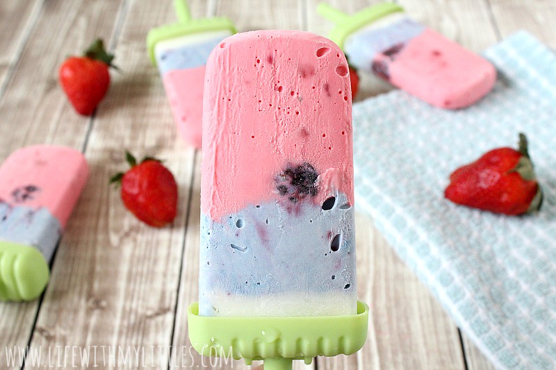These patriotic popsicles are the perfect Fourth of July dessert! Red, white, and blue creamsicles with strawberry and blackberry inside! Yum!