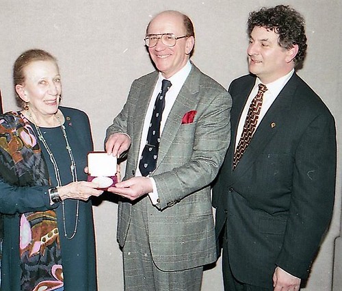 Leonda finke receiving the Saltus Medal from Stephen K. Scher and Alan M. Stahl
