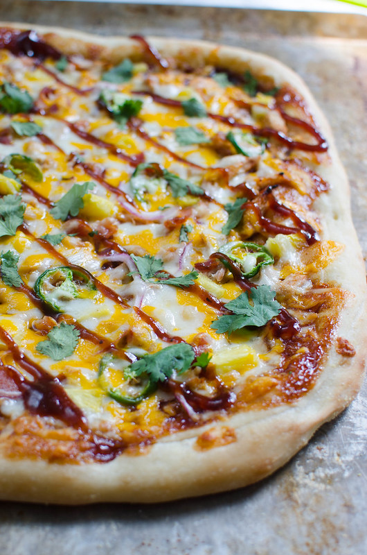 BBQ Pulled Pork Pizza recipe - delicious sweet and spicy pizza. Layers of barbecue sauce, pulled pork, jalapenos, pineapple, and lots of cheese!