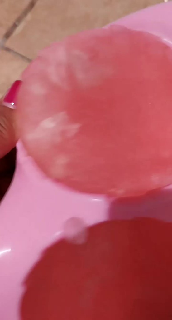 Ice cubes of rosé wine