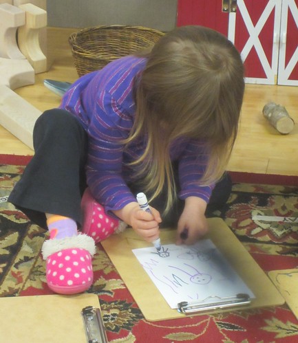 drawing her family portrait