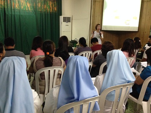 The image shows participants attending seminar spoken by Ms. Dang Koe.