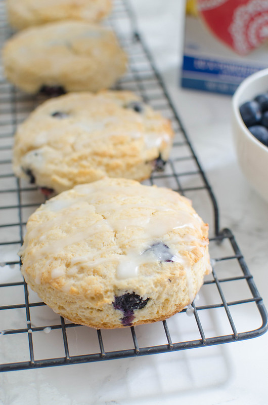 Glazed Blueberry Biscuits - delicious lightly sweetened biscuits with fresh blueberries and a glaze. Bojangles copycat!