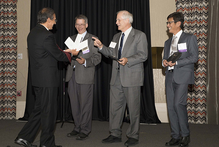Los Alamos scientists Bruce Carlsten, Richard Sheffield and Dinh Nguyen receive the 2017 Free Electron Laser Prize at an international conference hosted in Santa Fe.