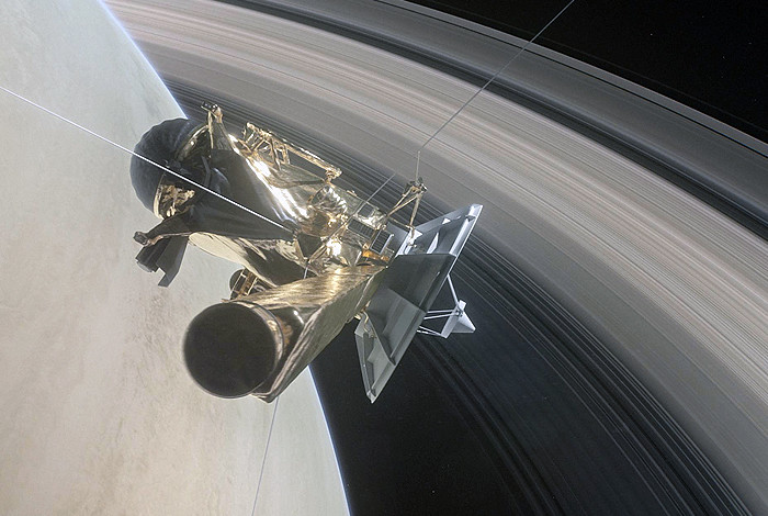 This illustration shows NASA’s Cassini spacecraft about to make one of its dives between Saturn and its innermost rings as part of the mission’s grand finale. 