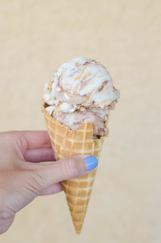 S'mores Frozen Yogurt - your new favorite summer treat! It starts with regular vanilla yogurt and turns into the most delicious s'mores froyo with a fudge swirl, graham crackers, and mini marshmallows.