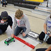 Students prepare their car to race at last year’s Electric Car Challenge held at Albuquerque’s Van Buren Middle School.
