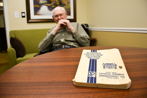 George Baker in the background with his copy of the 1941 API Bulletin on a table