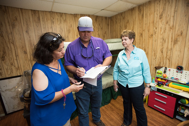 Co-farmer/producer Joyce Lenhart (left) receiving help from USDA employees