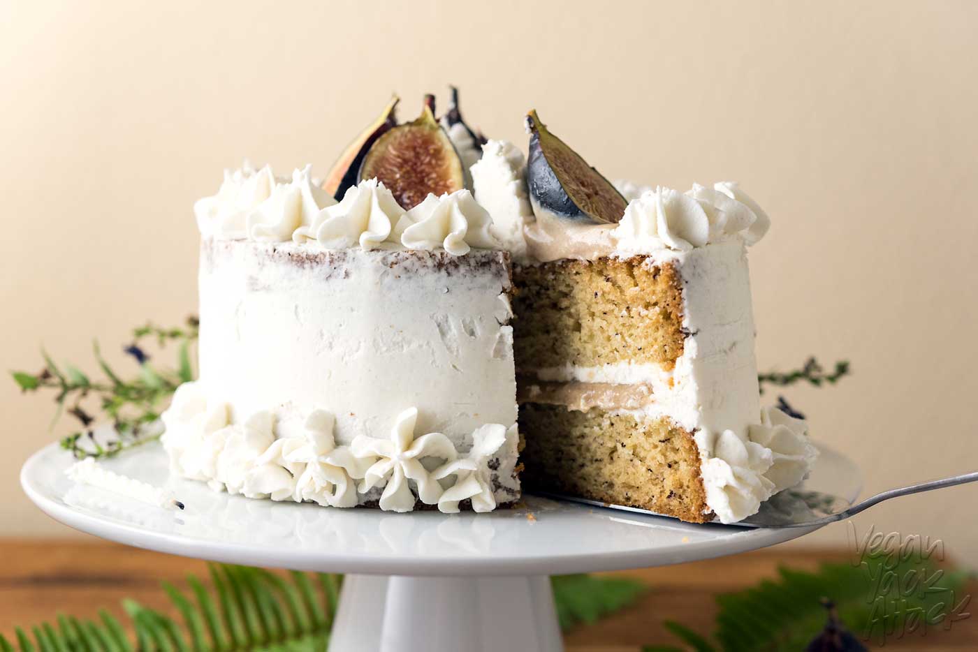 This Caramel Fig Vanilla Layer Cake has gorgeous layers of vegan buttercream, date caramel, and fluffy cake, topped with fresh figs! Soy-free, Dairy-free